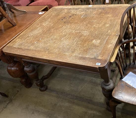 An 18th century style oak draw leaf dining table, width 190cm (extended) depth 106cm height 75cm